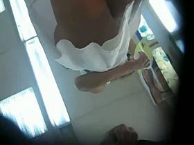 Provocative ass in a white thong upskirt spy cam video