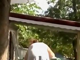 She cleans the porch while I peep her