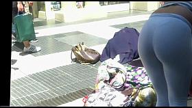 brunette in white pants bend over candid