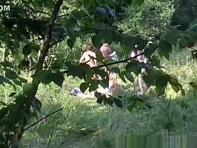 Two couples caught practicing swing outdoors