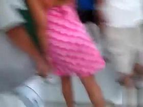 Beautiful senorita exposes her jugs to the crowd