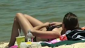 Cute girl fixing her bikini top