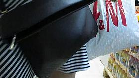 Girl in fishnet stockings upskirt in market