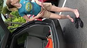 Woman changing in parking lot