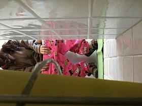 Dorm coed taking a piss and showing her teen pussy