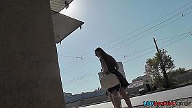 Alluring brunette shows off g-string in candid upskirts