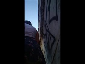 Upskirt walking girl in nice blue skirt