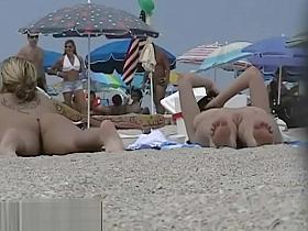 Blonde cutie undressing nudist beach voyeur video