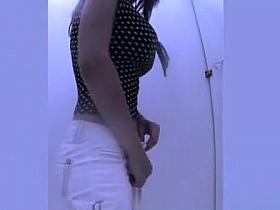 Busty hottie changing clothes in beach cabin