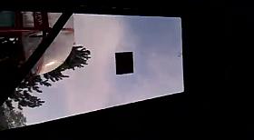 On the bus denim skirt and sweater in colorful stripes.