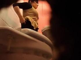 Hidden spy cam records chick in tiny thong pissing