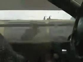 Lewd man sitting at the wheel and showing the piston