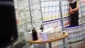 Massage demonstration on a topless woman