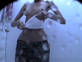 Skiny teen dressing in beach cabin