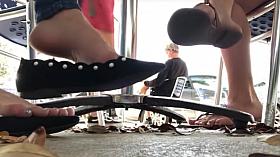 Candid flats dangling under table