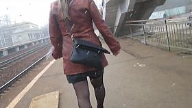 Girl in stockings going upstairs under the snow