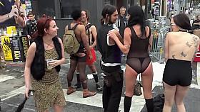 Inked topless babe offers herself for public whipping