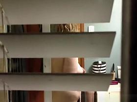 Husband spies his wife in bathroom through the window