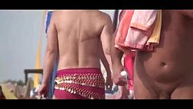 French nudist beach Cap d'Agde people walking in nature's garb 02