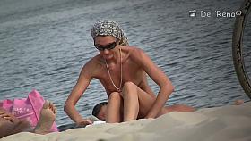 Cutie flaunts her perky tits in front of a nudist beach voyeur