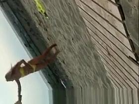 Sexy blonde chick in yellow bikini