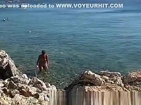 Naked on public beach