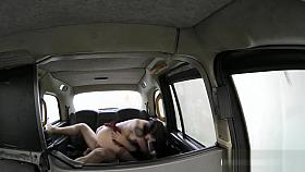 Lady in stockings sits on drivers cock in the backseat