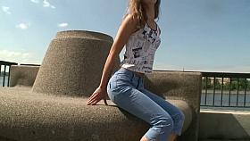 Brunette teen goddess rubs her whole body on the shore