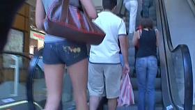 Hot brunette in a street candid video
