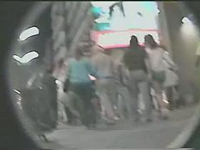 Two chicks in an upskirt public porno with nice round tushes