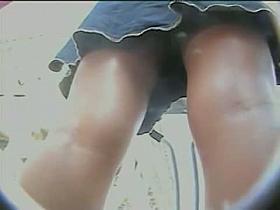 Wavy haired babe in skirt and bikinis in the upskirt clip