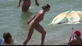 See those smooth nudists play at a public beach