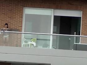 Voyeur films two girls in building across the street