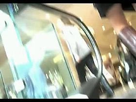 Voyeur works mall escalator for sexy up skirt views