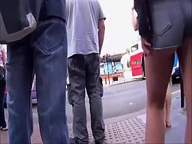 Nervous chick keeps pulling her shorts