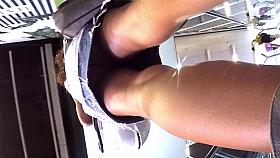 Upskirt of a beauty in jeans miniskirt