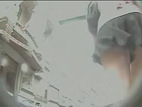 Curvy blonde treats us to an upskirt view of her ass