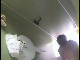 Hottie taking a piss at the pool's public bathroom