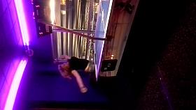 chubby busty candid blonde playing air hockey in the arcade