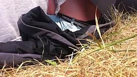 Youthful woman showing darksome strap at air show