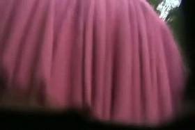 A hot young slut's rear end in an upskirt thong video