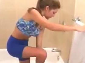 Brunette taking a shower