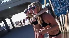 Blonde babe in black bikini has huge tits