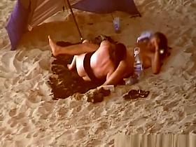 Chubby woman blows cock in the beach