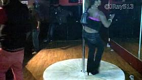 Girl in all black club pole dance