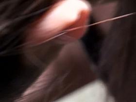 She is signing a paper while he films her asian boobies