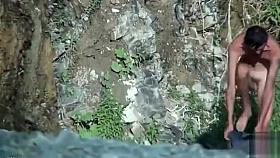 Nude amateur showers in a waterfall