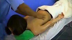 Stunning brunette model receives a buttock massage