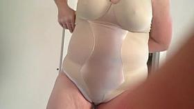 squeezing into her silk body stocking.