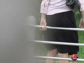 Sharking her skirt to lock her panties to the metal rail